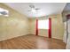 Bright bedroom with natural light, wood-look flooring, and a contemporary ceiling fan at 635 Dry Valley Ave, North Las Vegas, NV 89031