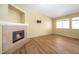 This bright living room offers a fireplace and natural light, featuring laminate floors at 635 Dry Valley Ave, North Las Vegas, NV 89031