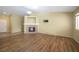 Bright living room with a fireplace, laminate floors and natural light, offering a relaxing atmosphere at 635 Dry Valley Ave, North Las Vegas, NV 89031