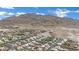 Aerial view showing neighborhood and desert with view of mountains in the background at 6927 Adobe Villa Ave, Las Vegas, NV 89142