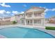 Beautiful two-story home exterior with a pool, balcony, and well-maintained backyard at 6927 Adobe Villa Ave, Las Vegas, NV 89142