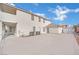 Spacious backyard featuring a large concrete patio with AC units and block wall fencing at 6927 Adobe Villa Ave, Las Vegas, NV 89142