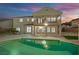 Beautiful pool reflecting the home's exterior under a colorful sky at 6927 Adobe Villa Ave, Las Vegas, NV 89142