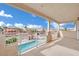 Balcony view showcasing a sparkling pool, lush landscaping, and neighborhood views at 6927 Adobe Villa Ave, Las Vegas, NV 89142