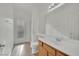 Bathroom features a shower, toilet, sink and door to exterior at 6927 Adobe Villa Ave, Las Vegas, NV 89142