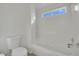 Bathroom featuring a bathtub and shower combination and neutral tile at 6927 Adobe Villa Ave, Las Vegas, NV 89142