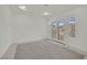 Bright room with double doors and neutral tile flooring, offering a serene and airy atmosphere with ample natural light at 6927 Adobe Villa Ave, Las Vegas, NV 89142