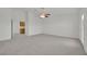 Expansive bedroom includes a ceiling fan, and doorway to an en-suite bathroom at 6927 Adobe Villa Ave, Las Vegas, NV 89142