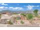 Backyard view showcasing desert landscaping and the Las Vegas city skyline at 6927 Adobe Villa Ave, Las Vegas, NV 89142