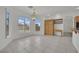 Open dining room with tile floor, large windows and chandelier at 6927 Adobe Villa Ave, Las Vegas, NV 89142