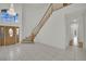 Grand entrance with a curved staircase and a decorative front door at 6927 Adobe Villa Ave, Las Vegas, NV 89142
