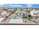Aerial view of a large two-story home with a three-car garage and well-maintained landscaping at 6927 Adobe Villa Ave, Las Vegas, NV 89142