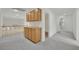 Upstairs hallway featuring built in cabinets, neutral carpeting, and access to multiple rooms at 6927 Adobe Villa Ave, Las Vegas, NV 89142