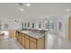 Spacious kitchen with granite countertops, island seating, and an open layout, ideal for entertaining and Gathering gatherings at 6927 Adobe Villa Ave, Las Vegas, NV 89142