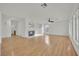 Open concept living room with wood floors and decorative fireplace at 6927 Adobe Villa Ave, Las Vegas, NV 89142