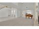 Expansive living area with high ceilings, elegant chandelier, fireplace, and grand piano, showcasing a sophisticated ambiance at 6927 Adobe Villa Ave, Las Vegas, NV 89142
