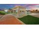 Relaxing poolside under the pergola, with brick patio and manicured landscaping, perfect for entertaining at 6927 Adobe Villa Ave, Las Vegas, NV 89142