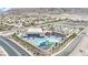 Community pool area featuring water slides, splash pad, umbrellas and ample parking at 6927 Adobe Villa Ave, Las Vegas, NV 89142