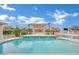 Sparkling pool and patio with a covered pergola and landscaped features at 6927 Adobe Villa Ave, Las Vegas, NV 89142