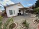 Backyard with gravel, covered patio, and low-maintenance landscaping at 7062 Russell Ranch Ave, Las Vegas, NV 89113