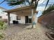 View of the patio and a low-maintenance gravel backyard at 7062 Russell Ranch Ave, Las Vegas, NV 89113