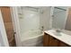 Bright bathroom with tub, white tile, and modern sink, a comfortable space at 7062 Russell Ranch Ave, Las Vegas, NV 89113