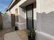 Covered front porch entrance with security screen door and tile flooring at 7062 Russell Ranch Ave, Las Vegas, NV 89113