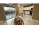 Bright kitchen with access to the backyard through a large sliding glass door at 7062 Russell Ranch Ave, Las Vegas, NV 89113
