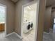 Convenient laundry room featuring a modern washer and dryer, with sleek grey flooring at 7062 Russell Ranch Ave, Las Vegas, NV 89113