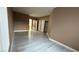 Spacious main bedroom with new flooring, access to walk-in closet and updated bathroom at 7062 Russell Ranch Ave, Las Vegas, NV 89113