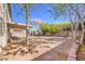 Expansive backyard featuring a covered patio, trees, and landscaping opportunities to create your outdoor oasis at 7176 Fenway Ave, Las Vegas, NV 89147