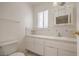 Bathroom with tiled countertop and cabinets at 7176 Fenway Ave, Las Vegas, NV 89147
