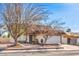 Charming single-story home with a well-maintained front yard, attached garage, and mature trees offering curb appeal at 7176 Fenway Ave, Las Vegas, NV 89147