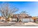 Cozy single-story home featuring desert landscaping, a two-car garage, and a brick-lined driveway at 7176 Fenway Ave, Las Vegas, NV 89147