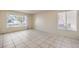 Spacious living room with bright natural light and tile flooring at 7176 Fenway Ave, Las Vegas, NV 89147