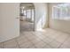 Bright room with tile floors next to the kitchen at 7176 Fenway Ave, Las Vegas, NV 89147