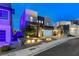 Contemporary home boasting stylish desert landscaping, outdoor lighting, and a modern garage door at 746 Horizon Canyon Dr, Henderson, NV 89052