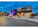 Modern two-story home with desert landscaping, walkway lighting, and a glass panel garage door at 746 Horizon Canyon Dr, Henderson, NV 89052