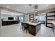 Bright kitchen with a large island, access to the living room and workout room at 746 Horizon Canyon Dr, Henderson, NV 89052
