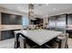 Elegant kitchen featuring a large island and stainless steel appliances at 746 Horizon Canyon Dr, Henderson, NV 89052