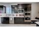 Modern kitchen with stainless steel appliances and dark cabinets at 746 Horizon Canyon Dr, Henderson, NV 89052