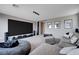 The living room features a large screen setup, comfortable seating, and dim lighting for immersive entertainment at 746 Horizon Canyon Dr, Henderson, NV 89052