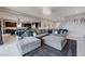 Open-concept living room featuring contemporary decor, a large sectional sofa, and seamless flow to the kitchen at 746 Horizon Canyon Dr, Henderson, NV 89052