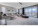 Cozy living room with plush seating, a large sectional sofa, and sliding glass doors to an outdoor patio at 746 Horizon Canyon Dr, Henderson, NV 89052