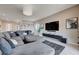 Cozy living room showcasing a large sectional sofa, mounted TV, and stylish contemporary design at 746 Horizon Canyon Dr, Henderson, NV 89052