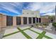 A landscaped side yard includes modern privacy panels, decorative rocks, and artificial turf, creating an elegant outdoor space at 746 Horizon Canyon Dr, Henderson, NV 89052