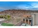The backyard backs up to a scenic desert landscape with rocks and native vegetation at 746 Horizon Canyon Dr, Henderson, NV 89052