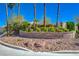 Canyon Ranch Estates with brick sign, beautiful palm trees and rock landscape at 7461 Tahoe Basin Dr, Las Vegas, NV 89129