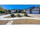 This single-story home has a spacious two car garage and is well maintained with rock landscaping at 7461 Tahoe Basin Dr, Las Vegas, NV 89129
