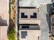 An aerial view of the neighborhood shows homes with solar panels, landscaping, and paved driveways in a planned community at 7476 Opal Star St, North Las Vegas, NV 89084